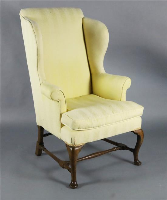 A George II mahogany wing armchair, W.2ft 3in. D.2ft 6in. H.3ft 11in.